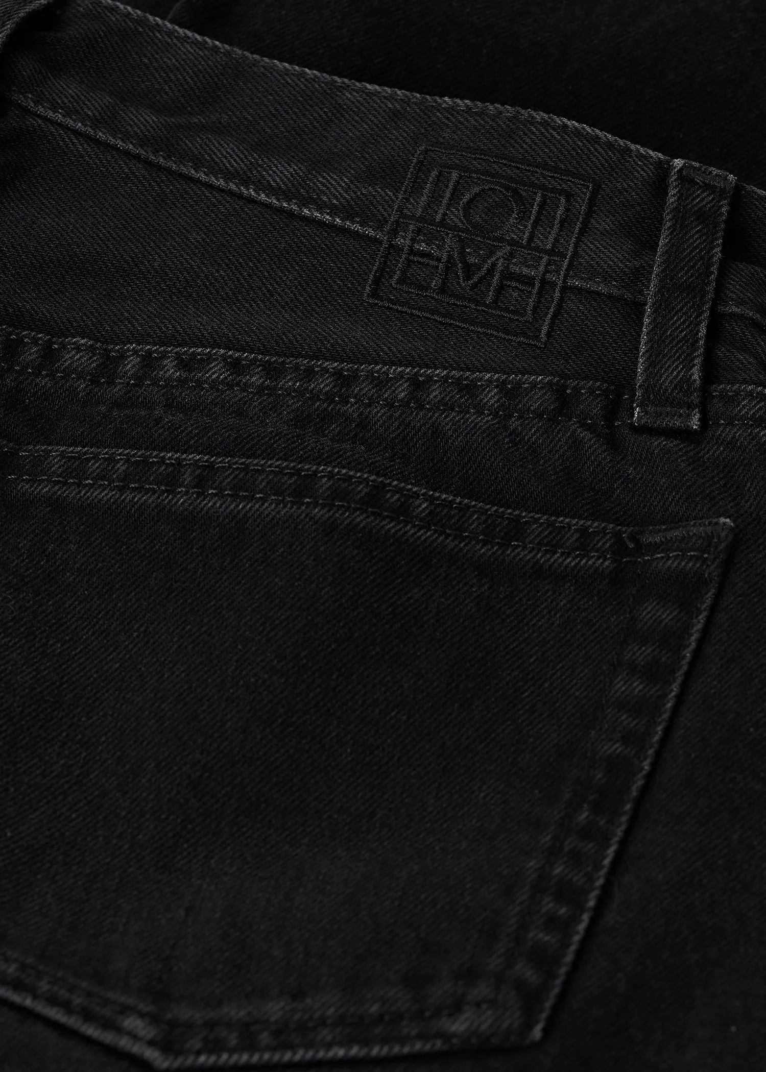 Twisted seam denim full length faded black